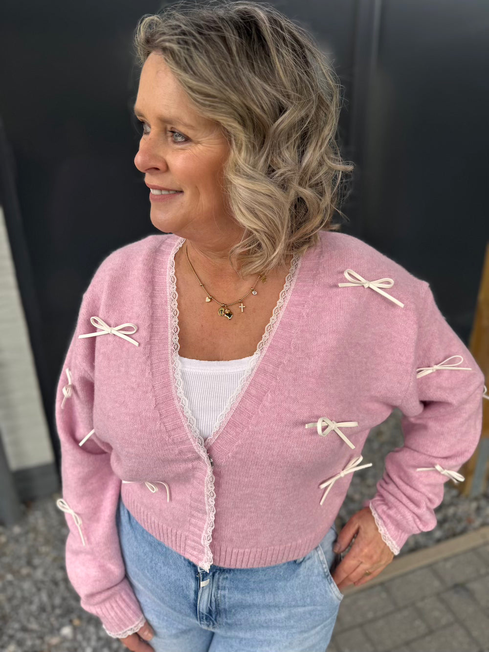 Vestje met strikjes roze