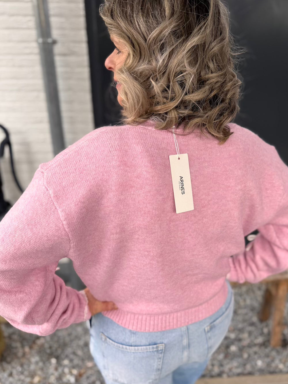 Vestje met strikjes roze