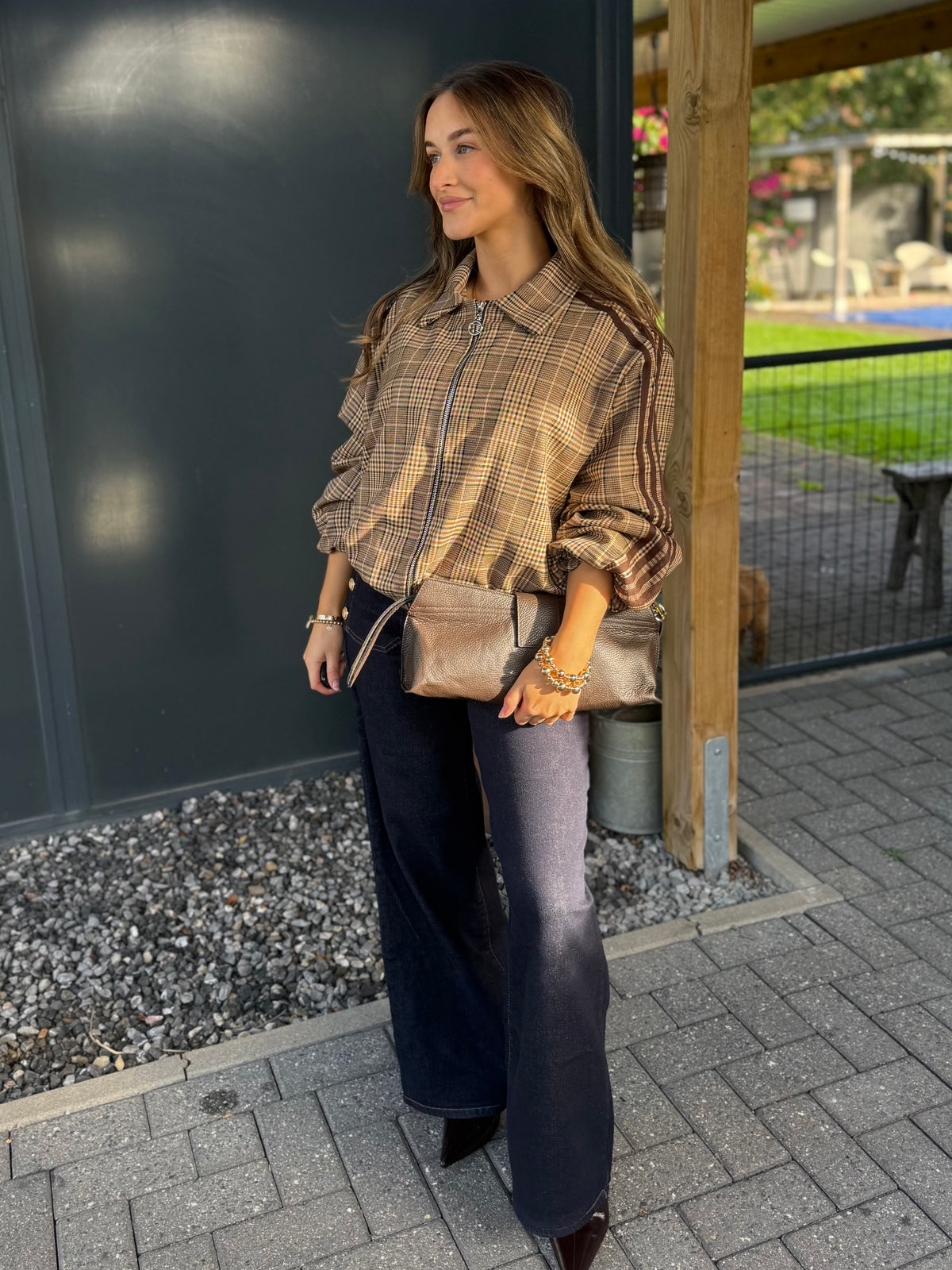 Lederen clutch met gouden ring en schouderriem