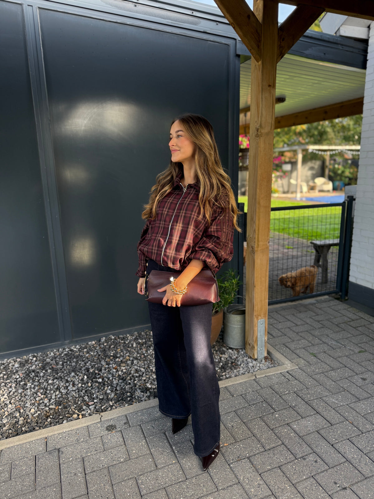 Lederen clutch met gouden ring en schouderriem