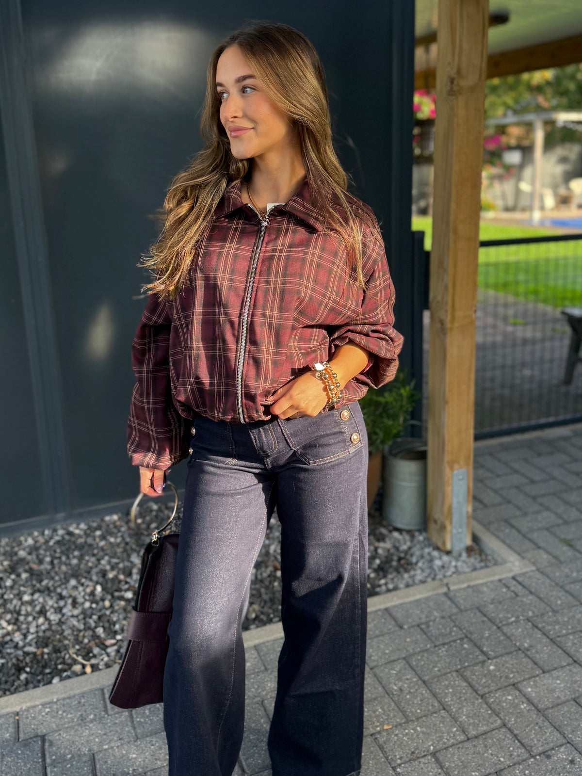Lederen clutch met gouden ring en schouderriem