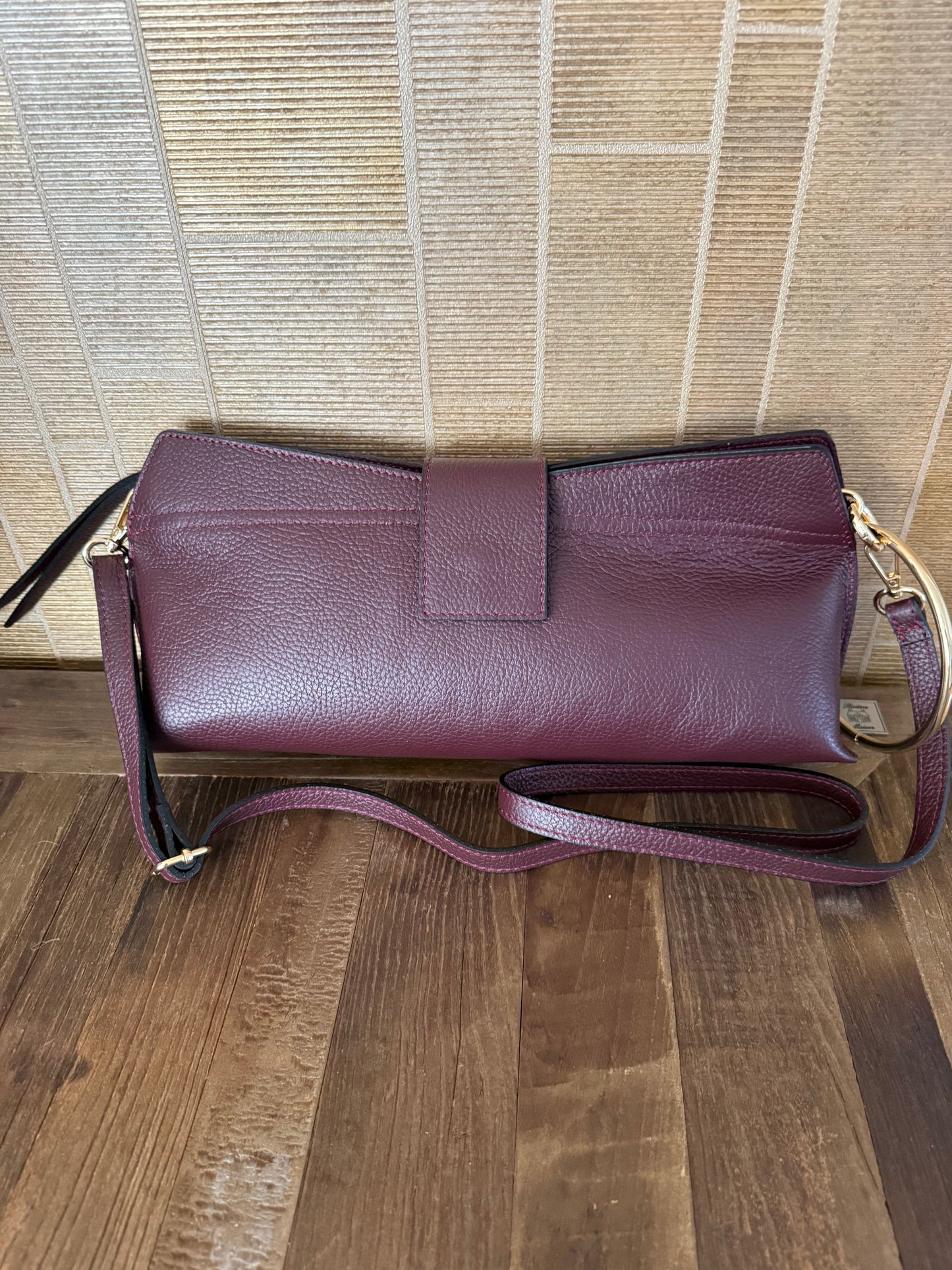 Lederen clutch met gouden ring en schouderriem