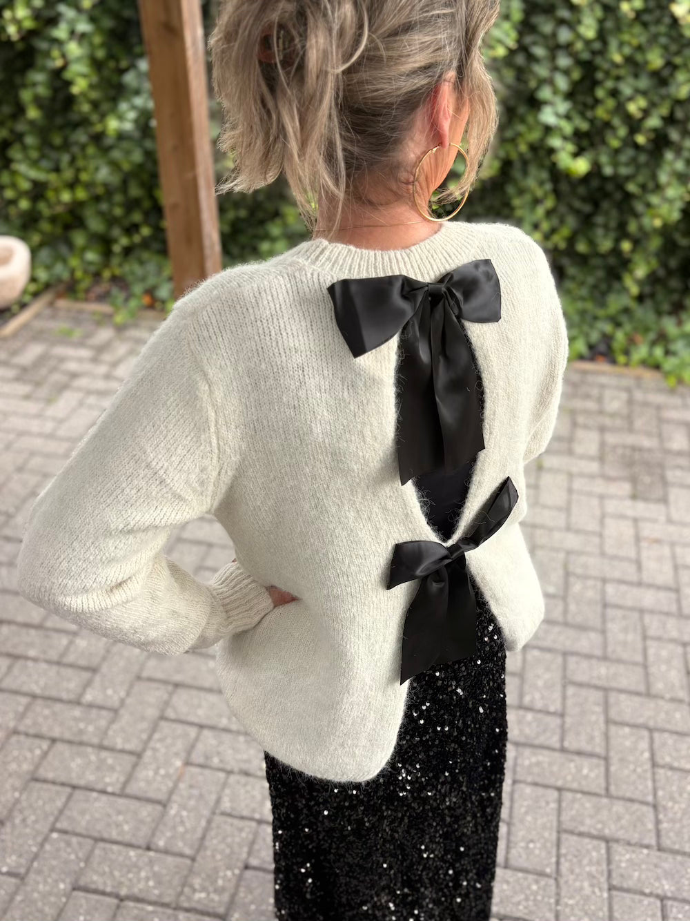 Trui creme zwarte strikken