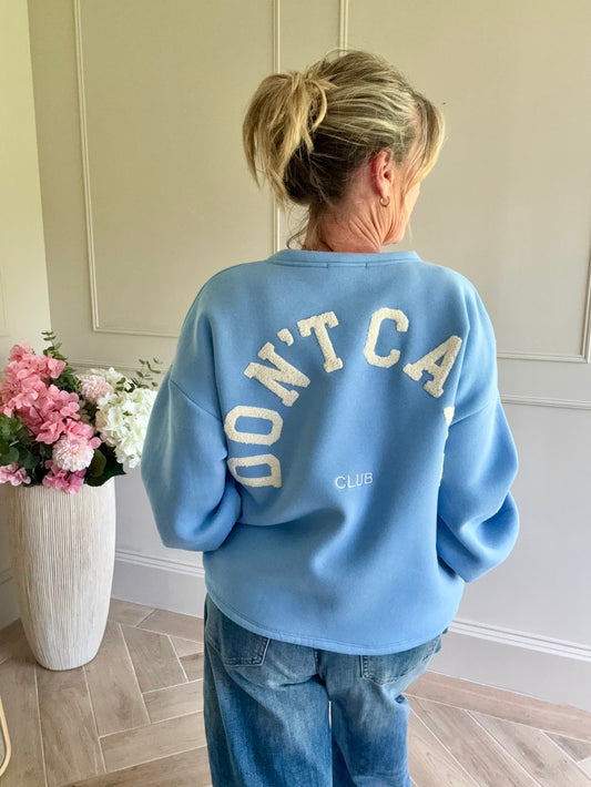 sweater don't care club lichtblauw