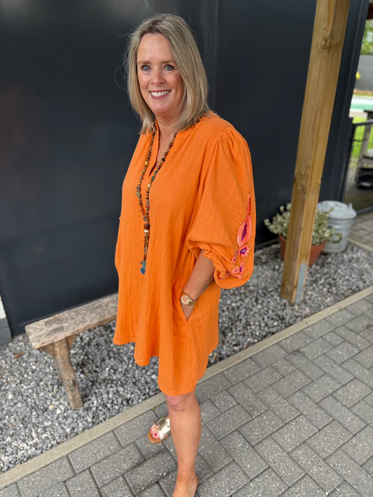 wijde jurk oranje met pailetten