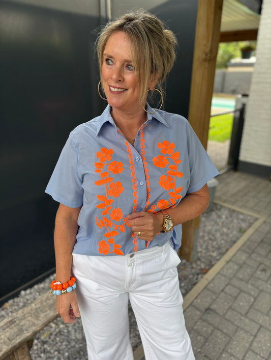 blouse blauw met oranje bloemen